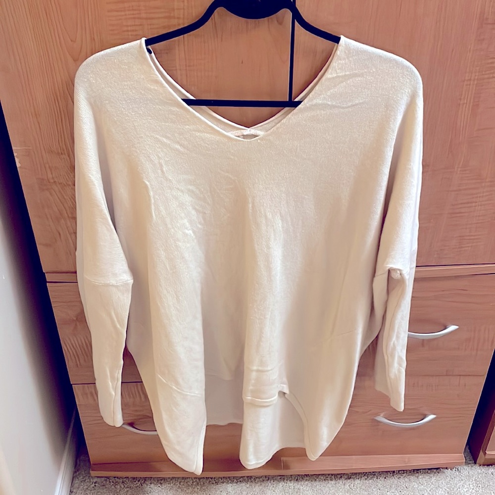 Over-sized, V-neck front and back, high-low sweater